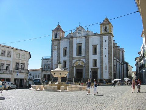 The historic white-walled streetscape of Évora town centre in the Alentejo region